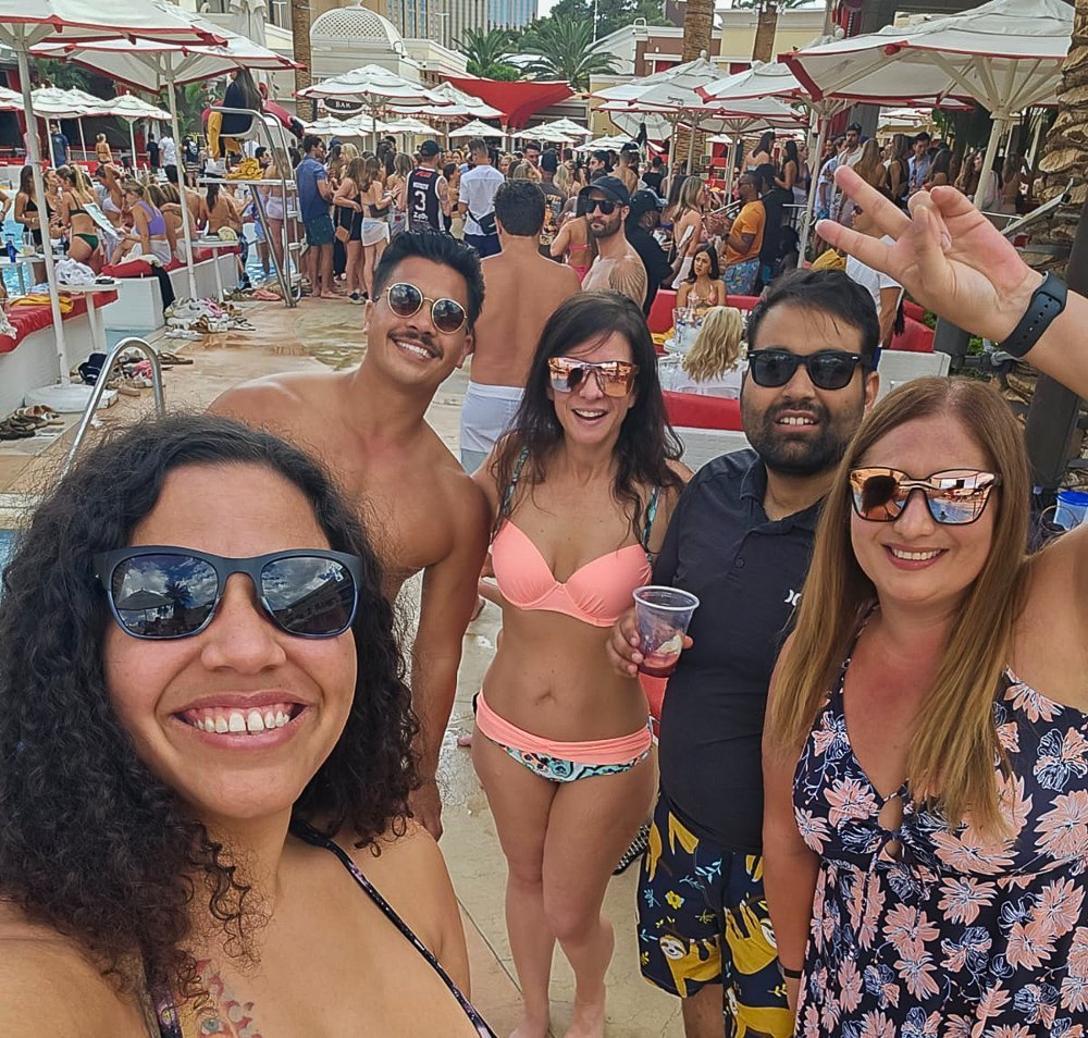 closeup selfie of five of the six of us at the encore beach club in las vegas celebrating hiking the wave in arizona
