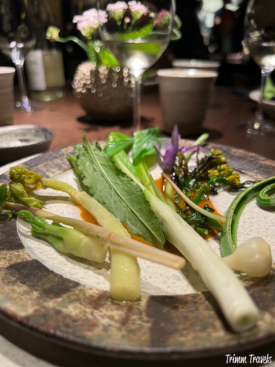 seasonal raw green vegetables served with an orange lobster sauce