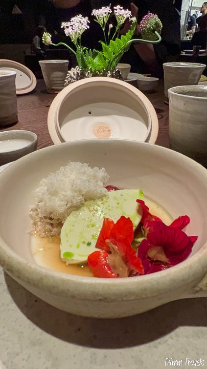 white bowl dish with red, green, and white food arranged